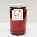A glass jar with a white lid contains Bella Cucina Chestnut Honey—amber in color, 100% organic, 8.8 oz (250g), and authentic biodynamic honey from Piedmont, Italy.
