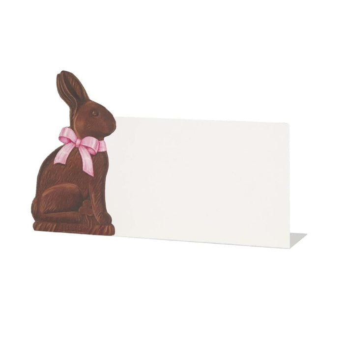Hester & Cook’s Chocolate Bunny Place Cards (Pack of 12) feature a bunny with a pink ribbon beside a blank card—ideal as charming labels or place cards for your Easter table.