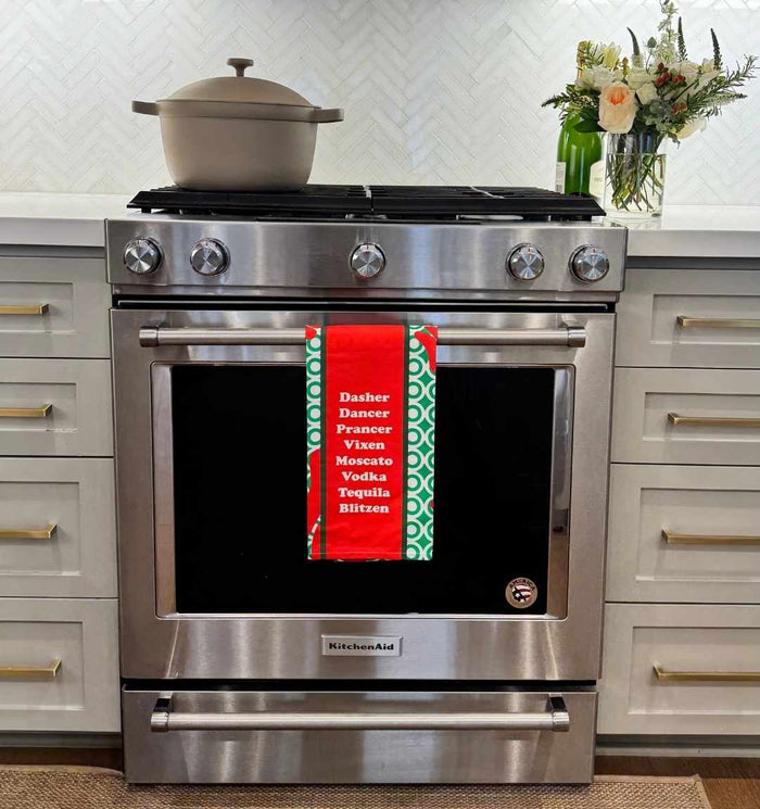 Add holiday cheer to your kitchen with the CHRISTMAS Blitzen Dish Towel by Drinks On Me—featuring reindeer names like “Vodka,” “Tequila,” and “Blitzen”—for a perfect touch of humor on your stainless steel stove.