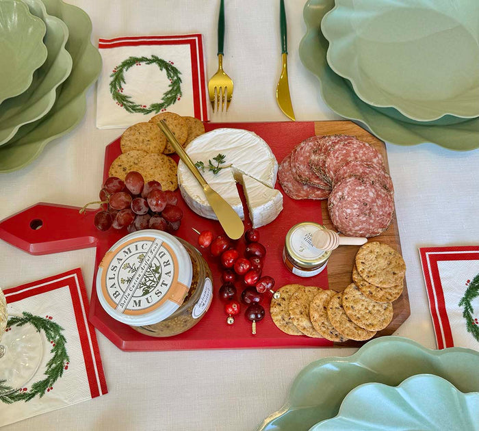 The Sophistiplate Christmas Board Gift Kit: Merry & Bright features salami, crackers, Brie, grapes, cranberries, and balsamic mustard on an acacia platter—an ideal hostess gift with festive plates and napkins for any holiday table.