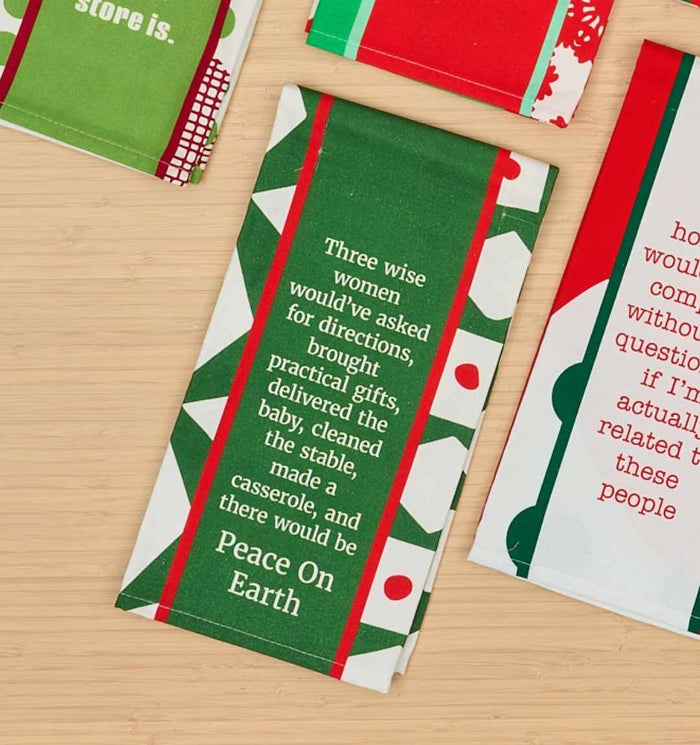 The CHRISTMAS Peace on Earth Dish Towel by Drinks On Me features a green and white holiday design with red accents and the saying: "Three wise women would've asked for directions, brought practical gifts, delivered the baby, cleaned the stable, made a casserole, and there would be peace on earth.