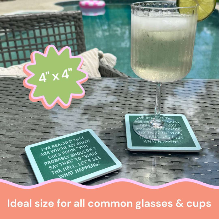 A light drink with lime sits on a 4" x 4" Drinks On Me Coaster Bundle: Growing Old coaster atop a wicker table. Another matching coaster and a pool float are seen. Text says "Ideal size for all common glasses & cups.