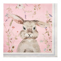 The Sophistiplate Cocktail Napkin Charming Easter (26/pkg) features a pastel pink design with a watercolor brown bunny amid flowers and greenery, plus a white border with blue line—perfect for brunch or cocktail settings.