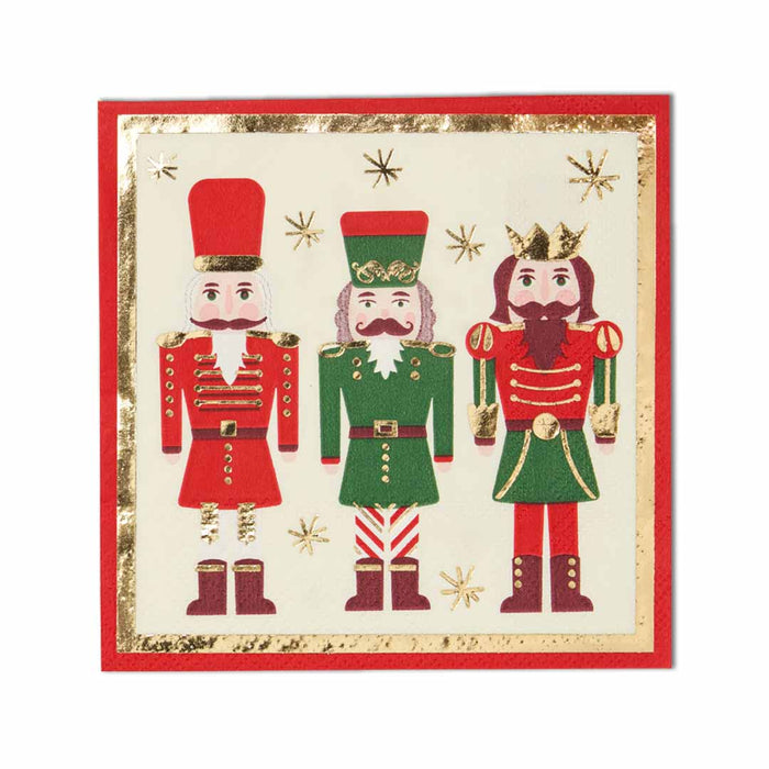 Sophistiplate Cocktail Napkin Nutcracker Christmas (20/pkg) features three festive nutcrackers in red, green, and gold on a cream background with gold stars and foil detail, framed by a bold red border—perfect for holiday gatherings.
