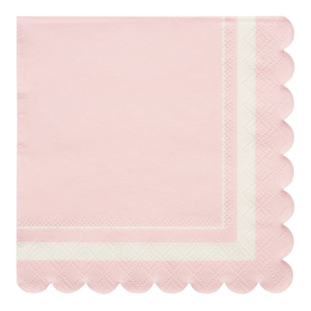 The Sophistiplate Cocktail Napkin Scalloped Edge Blush/20 pkg features light pink, compostable napkins with a white scalloped border from our eco-friendly tableware collection, shown against a white background.