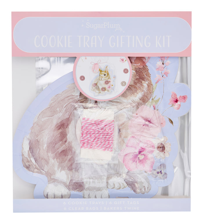 The Sugarplum Cookie Tray Gifting Kit Charming Easter/6pkg features pastel packaging, a bunny and floral design, gift tags with rabbits, pink baker’s twine, and clear bags—ideal for sharing Easter treats.