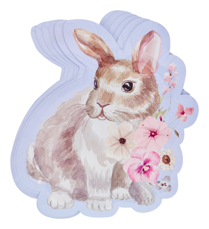 A pastel illustration of Sugarplum’s Cookie Tray Gifting Kit Charming Easter/6pkg shows a brown and white bunny-shaped plate with pink flowers and foliage near its face, set against a light purple background—perfect for Easter treats.