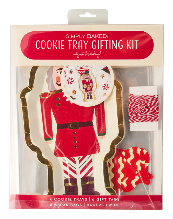 The Sugarplum Cookie Tray Gifting Kit Nutcracker/6pkg includes 6 nutcracker-shaped trays, 6 festive tags, 6 clear bags, and red & white baker’s twine—ideal for holiday treat exchanges.