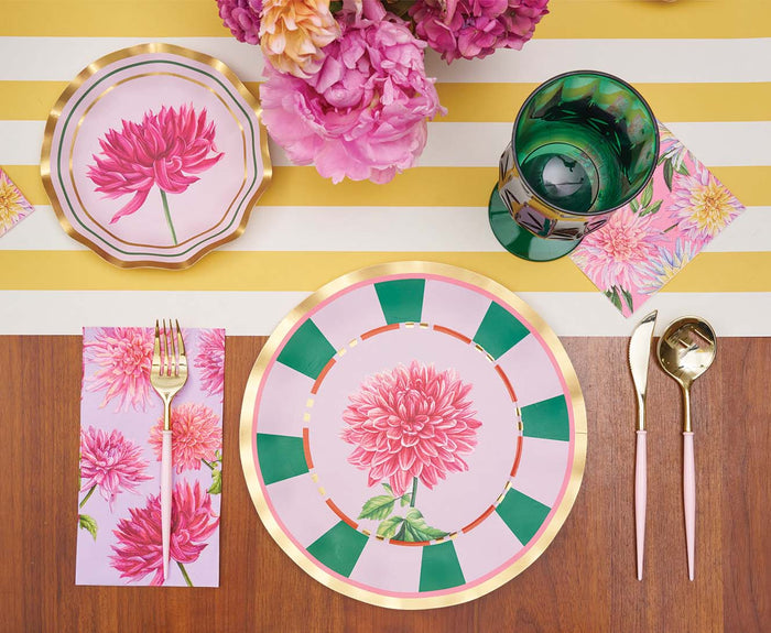 Create a vibrant table setting with floral plates, gold utensils, a green glass, and pink flower napkins atop a yellow and white striped runner. The look is completed with Sophistiplate’s Dahlia Garden Appetizer/Dessert Bowls (8-pack), perfect for serving appetizers and beautifully complemented by a bouquet of pink flowers.