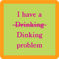 The Drinks On Me Dinking Coaster is a green square with an orange border featuring "I have a ~Drinking~ Dinking problem" in pink—ideal as a funny drink coaster or quirky bar cart accessory and perfect for housewarming gifts.