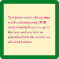 A cream square coaster with green borders and pink text jokes that entering your birth date on a phone feels like spinning Wheel of Fortune—a top pick from Drinks On Me’s Coaster Bundle: Best Sellers 2, making a hilarious gift for friends.