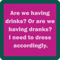The Drinks or Dranks Coaster by Drinks On Me features bold white text on a magenta background with a teal border—perfect for adding humor to your bar cart or as a unique, funny drink coaster.
