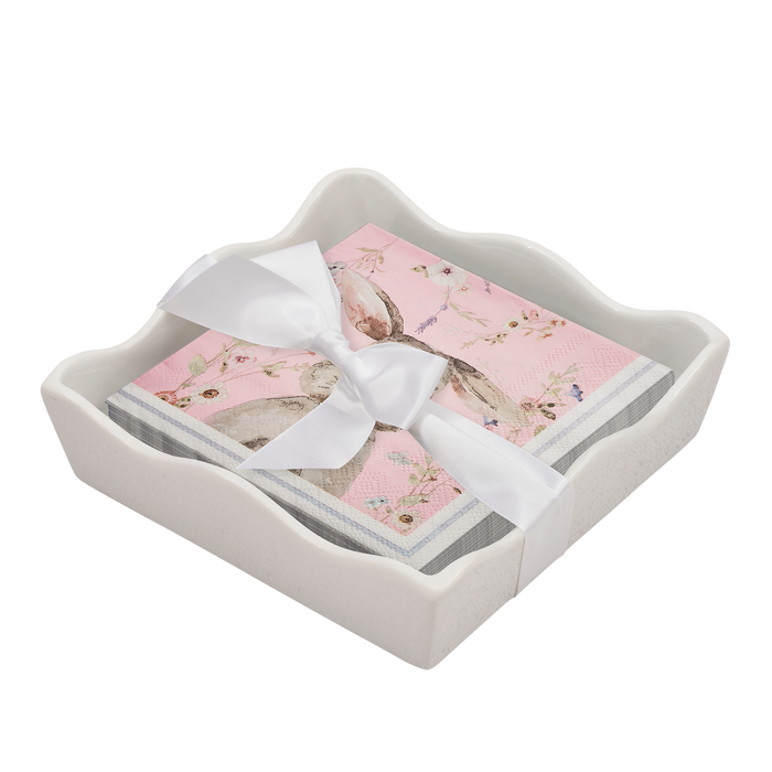 The Sophistiplate Easter Cocktail Napkin with Napkin Tray features pink floral bunny napkins neatly tied with a white satin ribbon in a white ceramic tray—a charming, modern tabletop accent.