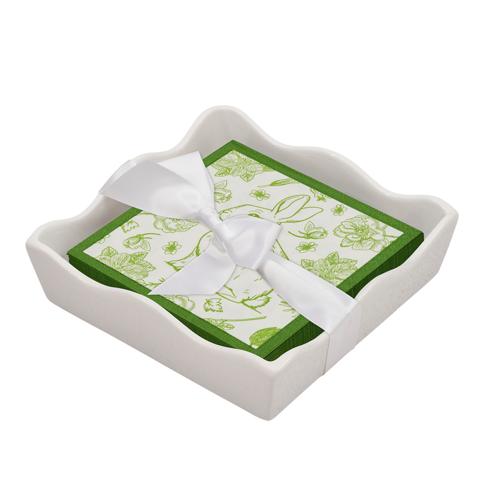 The Sophistiplate Easter Cocktail Napkin with Napkin Tray is a modern tabletop accent, featuring green and white floral napkins neatly arranged in a white ceramic tray.