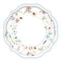 The Sophistiplate Easter Fields Dinner Plates/16pk feature scalloped white edges, a pale blue rim, and a floral border in pink, blue, purple, and white—ideal for any spring gathering.