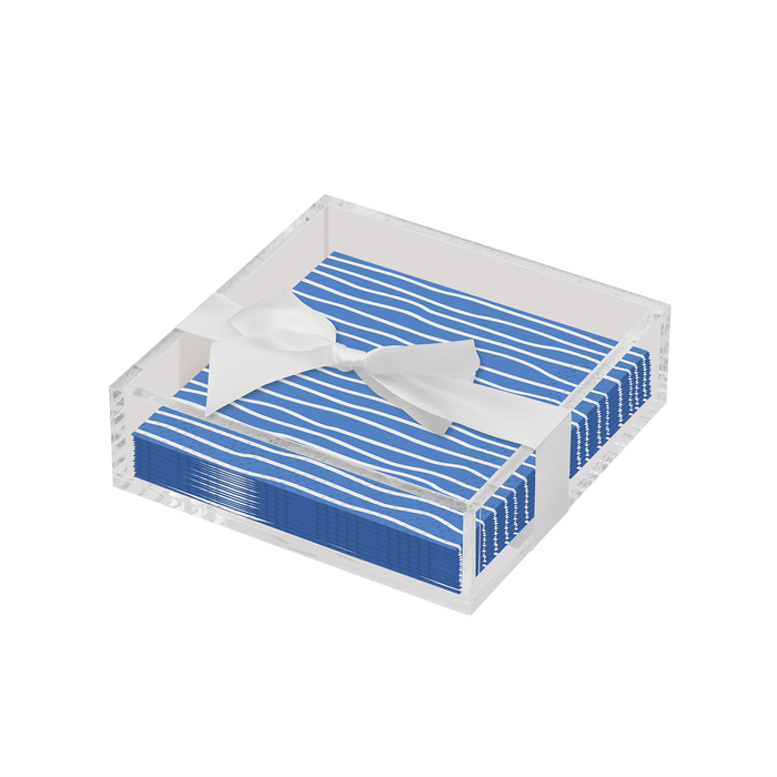The Sophistiplate Eco Cocktail Napkin with Napkin Tray features stylish blue striped napkins tied with a white ribbon in a clear tray—ideal for a modern tabletop display.