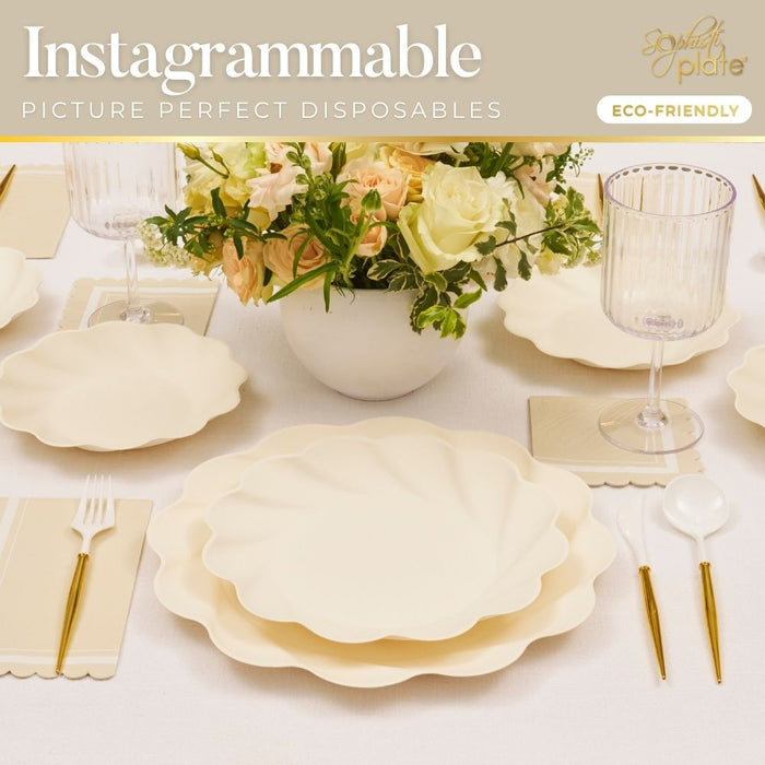 Sophistiplate's Eco-Friendly Table Setting—Cream includes scalloped compostable plates, matching cutlery, ribbed wine glasses, and a floral centerpiece for eco-conscious, picture-perfect gatherings.