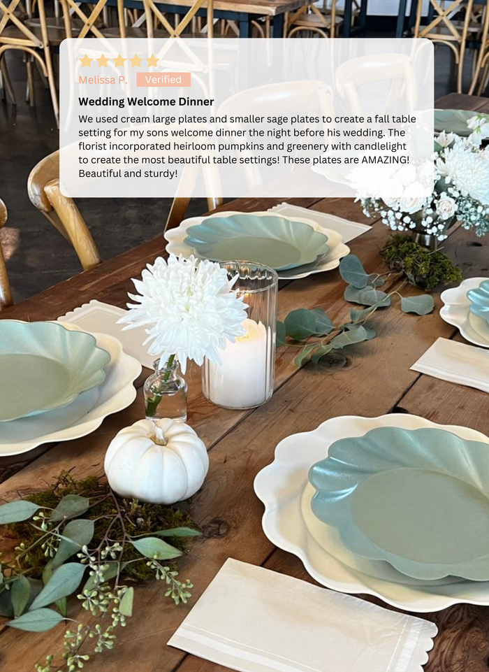 A rustic dining room is set for fall with Sophistiplate's Eco-Friendly Table Setting- Sage, white flowers, greenery, candles, and pumpkins atop a wooden table and chairs. A review of the table setting appears at the top.