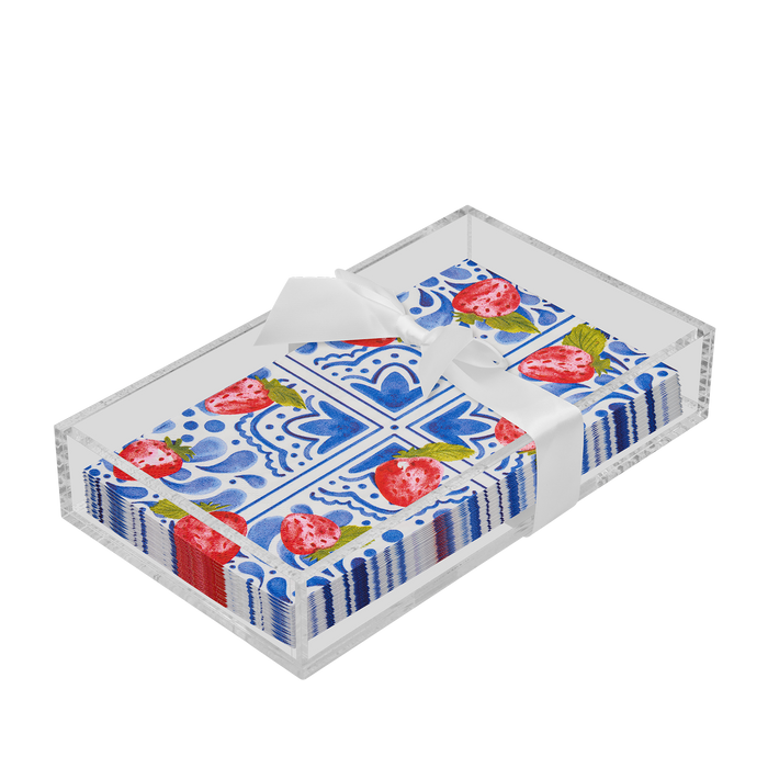 The Sophistiplate Everyday Guest Towel with Napkin Tray neatly displays patterned blue and white paper napkins with red strawberries, all tied with a white ribbon.