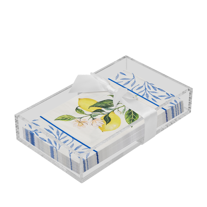 The Sophistiplate Everyday Guest Towel with Napkin Tray holds decorative lemon and leaf paper napkins, neatly stacked in a clear rectangular acrylic tray and tied with a white satin ribbon.