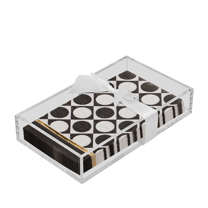 The Sophistiplate Everyday Guest Towel with Napkin Tray features black and white polka dot guest towels neatly arranged in a clear rectangular tray and tied with a white ribbon.