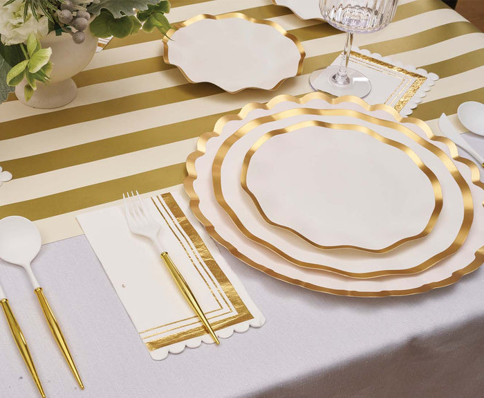 Create a festive and sophisticated tablescape with gold and white striped plates, gold cutlery, a wine glass, and a coordinating striped tablecloth. A floral arrangement graces the top left corner, while Sophistiplate’s Everyday White Appetizer/Dessert Bowls (8-pack) add an extra layer of refinement with their gold trim. This elegant setting is perfect for any special occasion.
