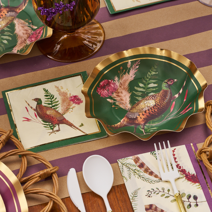 Create a stunning fall tablescape with the Sophistiplate Feather Grove Table Setting, featuring scalloped pheasant plates, matching bird napkins, white plastic cutlery, and floral accents on striped kraft paper placemats.