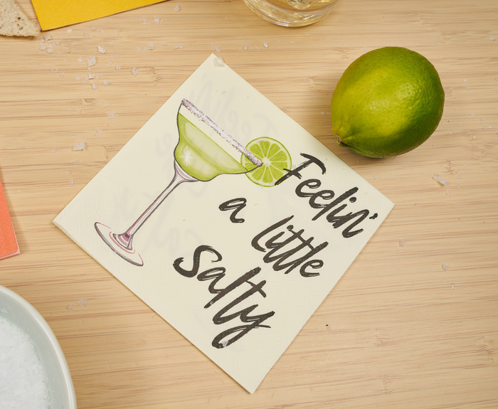 Sugarplum's "Feeling a little Salty" Cocktail Napkins (26pk) feature playful margarita and lime wedge art with the phrase “Feelin’ a little salty”—perfect for summer parties and beach gatherings.