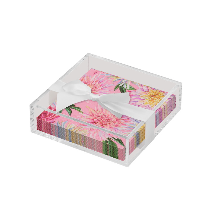 The Sophistiplate Floral Cocktail Napkin with Napkin Tray includes pink, floral-patterned napkins tied with a white ribbon in a clear acrylic tray—perfect for adding modern charm to your table.
