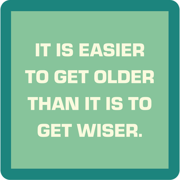 Bold white text on a light green background with a teal border reads, “IT IS EASIER TO GET OLDER THAN IT IS TO GET WISER”—a fun Drinks On Me Coaster Bundle: Birthday gift for friends or as part of a coaster set.