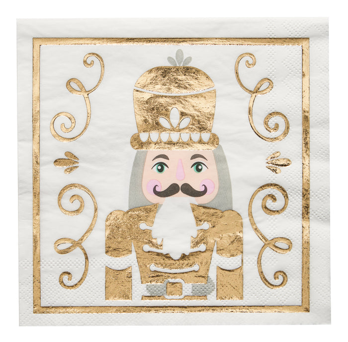 The Sophistiplate Gilded Nutcracker Paper Lunch Napkin (20pk) features a festive soldier with a gold hat and uniform, pink cheeks, and mustache amid gold swirls on white—ideal for adding holiday charm to your table.