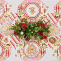 Create a festive table with the Gingerbread: Christmas Table for 8 set, featuring gingerbread-themed disposable plates, striped napkins, gold cutlery, and a red-and-white floral centerpiece on a holiday-patterned white cloth.