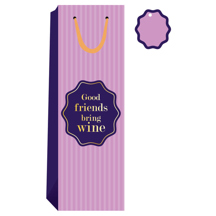 The Drinks On Me "Good Friends- Wine Bag" is a tall, pink and purple striped reusable wine bag with a gold handle and matching gift tag—ideal as a funny wine bag or hostess gift. The label reads, “Good friends bring wine.”.