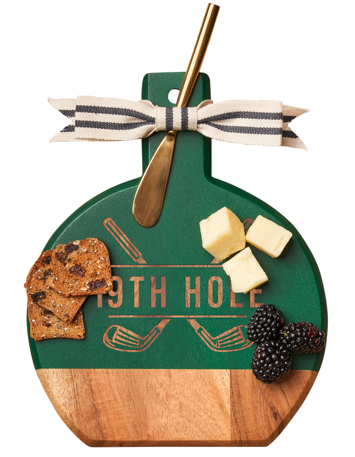 The Maple Acacia Bevel Board Green w/ Ribbon & Gold Spreader Knife features “19th Hole” text and golf clubs—ideal for golf lovers to serve crackers, cheese cubes, and berries in playful style. Measures 9.75 x 8".