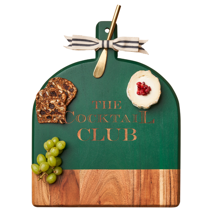 The Maple Acacia Bevel Board Green with Ribbon & Gold Spreader Knife (15x12", The Cocktail Club) is paired with crackers, green grapes, and round cheese topped with pomegranate seeds.