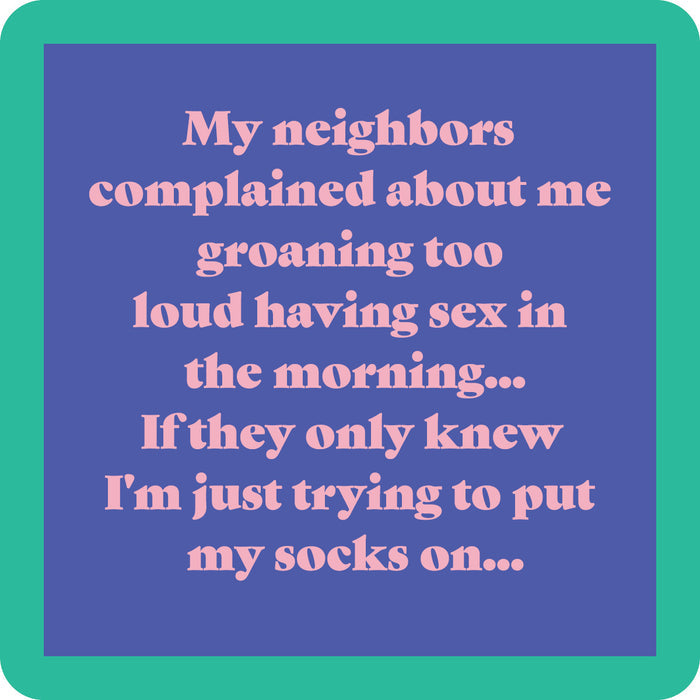 Drinks On Me's Groaning Coaster features a blue background, green border, and pink text: "My neighbors complained about me groaning too loud having sex in the morning... If they only knew I'm just trying to put my socks on..." Funny for drinks or housewarming gifts!.