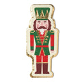 Add charm to your holiday table with Sophistiplate's Guest Towel Nutcracker Christmas/16 pkg, featuring a green and red nutcracker soldier in a gold-detailed uniform and crown, ideal for elegant seasonal décor.