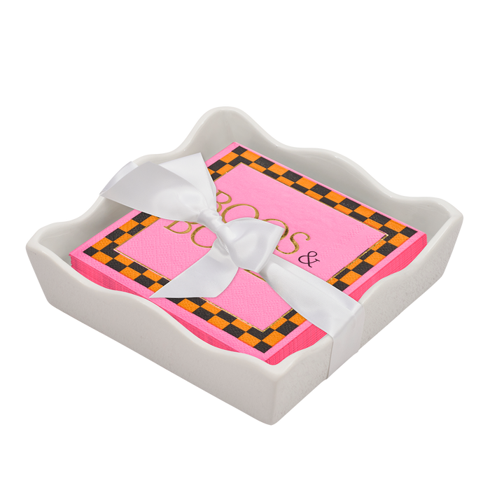 The Sophistiplate Halloween Cocktail Napkin with Napkin Tray features festive napkins in a white ceramic holder, tied with a ribbon—adding a charming, modern touch to your tabletop decor.