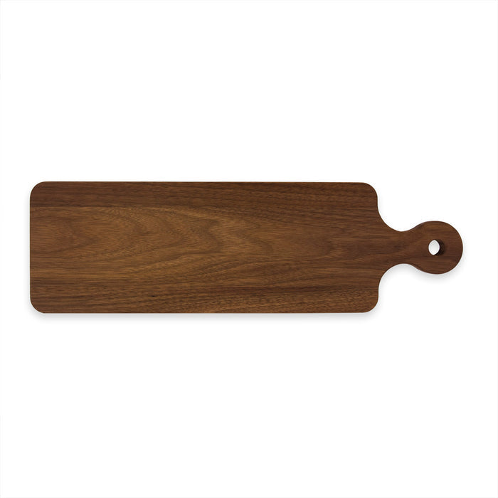 The Maple Handled Walnut Bread Board (20" x 6") is a rectangular serving board with rounded edges and a hanging hole, crafted from premium black walnut wood, shown on a white background.