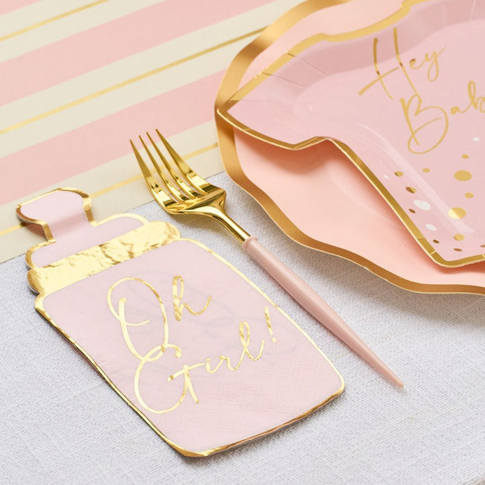 The Hey Baby Blush Table Setting by Sophistiplate LLC features dress-shaped plates with "Hey Baby," a gold fork, and a baby bottle-shaped napkin with "Oh Girl!" on a pastel pink and yellow striped background.
