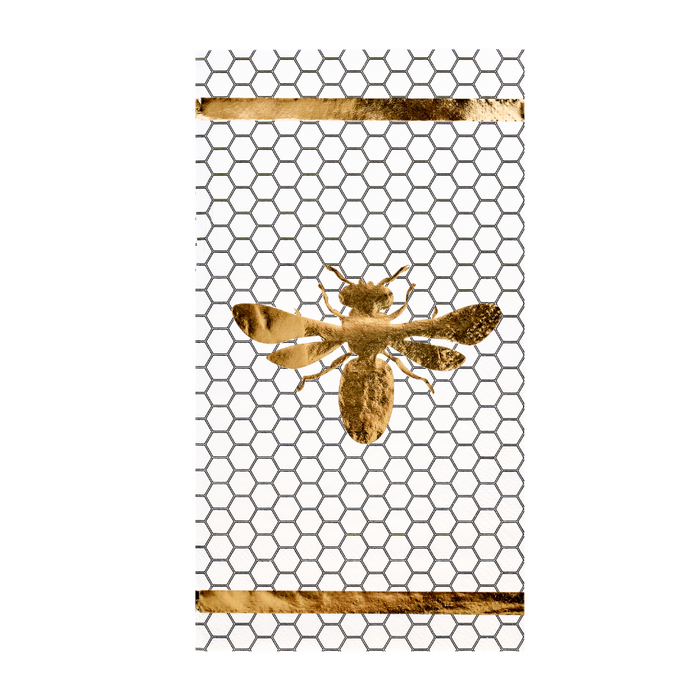 A gold bee is centered on a honeycomb wire mesh pattern with two horizontal gold bars at the top and bottom, set against a white background for an elegant look. The Sophistiplate Honeybee Guest Towels/20pk are perfect for pairing with metallic gold foil napkins or other honeybee-themed napkins to elevate any sophisticated gathering.