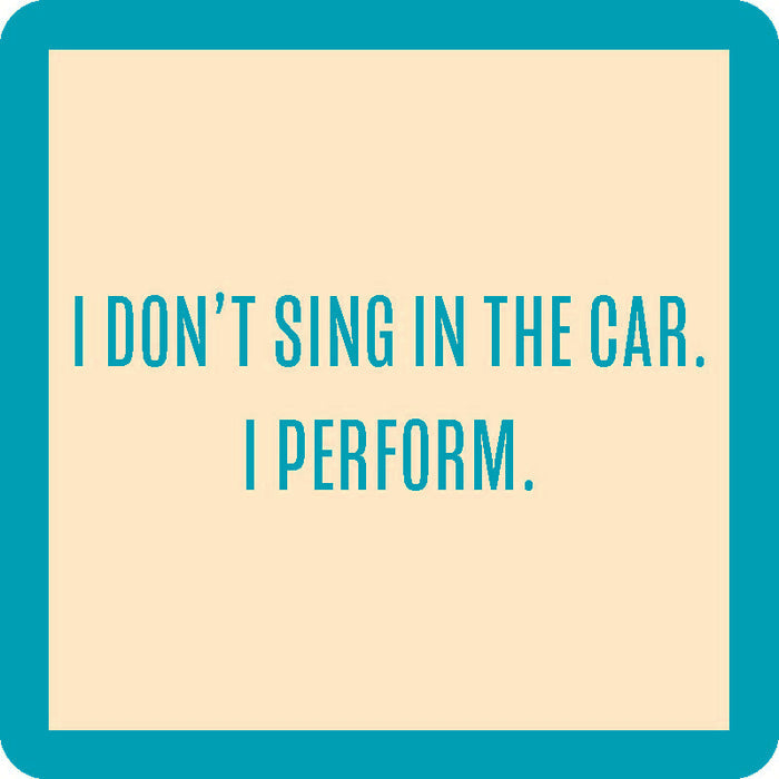 The I Perform Coaster by Drinks On Me features bold green text on a beige square with a green border—reading "I DONT SING IN THE CAR. I PERFORM."—a funny drink coaster perfect for unique housewarming gifts or bar cart accessories.
