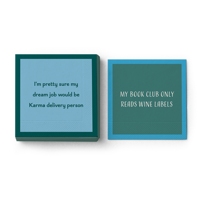 The Drinks On Me Karma Delivery Napkin set features two square cocktail napkins—one with a Karma delivery joke, the other about wine label book clubs—in teal and blue. Ideal as bar cart accessories or gifts to add humor to any gathering.