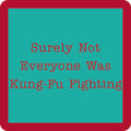 The Kung Fu Coaster by Drinks On Me features a teal square with a thick red border and red typewriter text: Surely Not Everyone Was Kung-Fu Fighting. A funny, quirky drink coaster for gifts or bar carts.