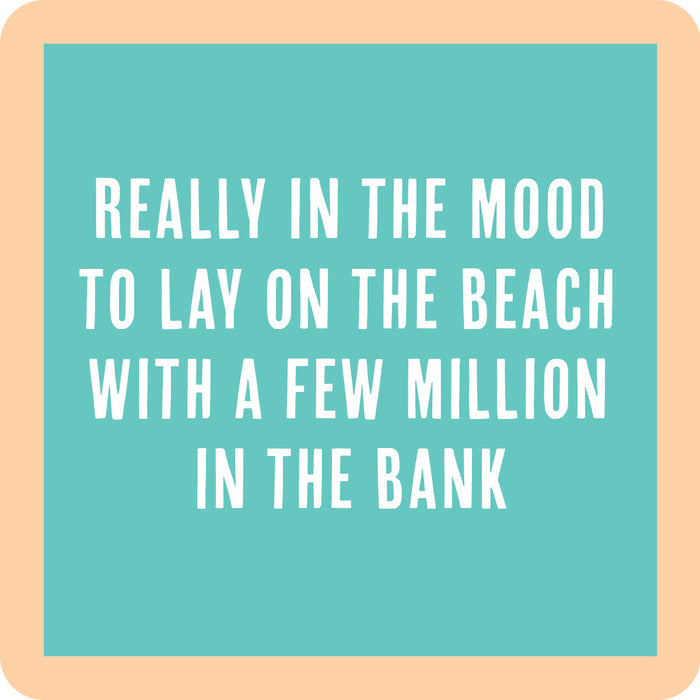 Text on a turquoise background with a beige border reads: "Lay on the beach with a few million in the bank"—perfect for housewarming gifts or as a funny drink coaster. Lay on Beach Coaster by Drinks On Me, in bold white letters.