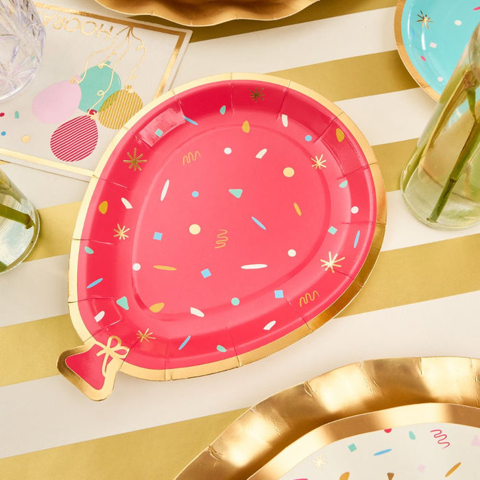 The Sophistiplate Let's Celebrate Table Setting features a pink, balloon-shaped disposable plate with gold trim and confetti accents—perfect for creating a stylish and festive tablescape-in-a-box.