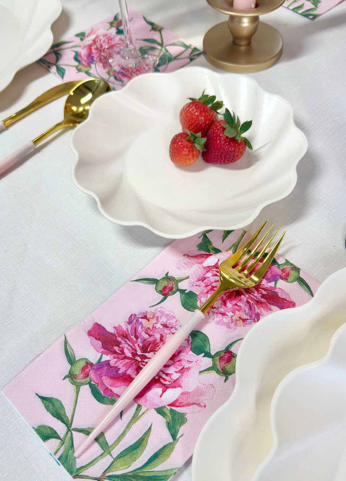 The Sophistiplate Love in Bloom Table Setting features a white scalloped designer plate with strawberries on a floral pink napkin, paired with gold and pink cutlery—creating a charming, coordinated tablescape-in-a-box.