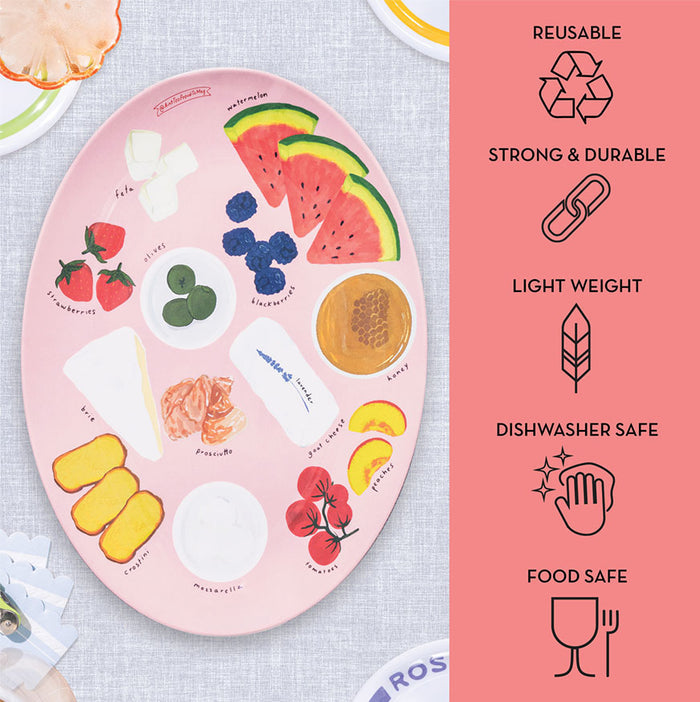 The Maple Meg Quinn Melamine Serving Tray features labeled food illustrations on a light background. To the right, icons show it's reusable, strong and durable, lightweight, dishwasher safe, and food safe with matching graphics.