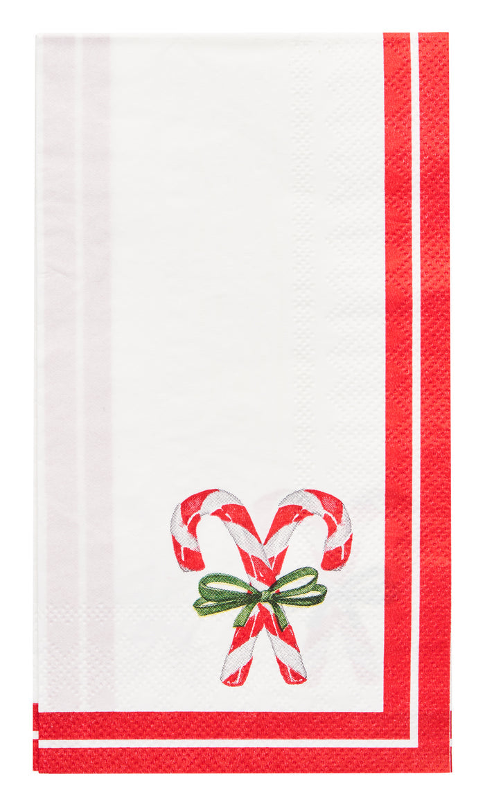 The Sophistiplate Merry and Bright Paper Guest Towel (20pk) features a white design with red borders and two crossed candy canes tied with a green bow—ideal for a festive table setting.
