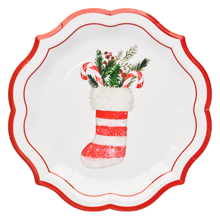 The Sophistiplate Merry and Bright Salad Plates (8pk) feature a festive design with a decorative red scalloped edge and a Christmas stocking adorned with greenery, holly, and two candy canes. The stocking showcases red and white stripes with a fluffy white cuff, making these plates perfect for creating a cheerful holiday table setting.
